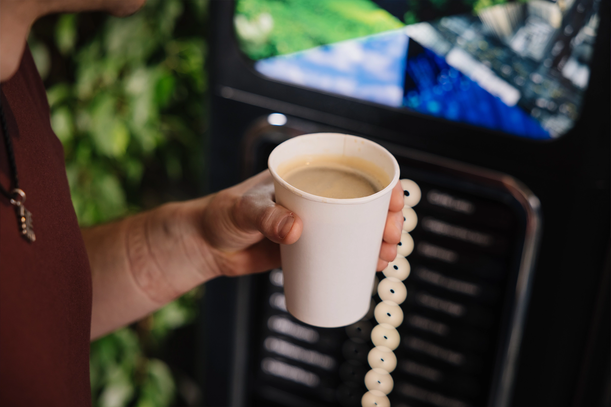 Drinking coffee by vending machine