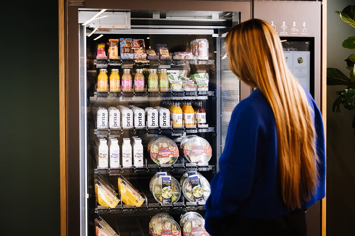 Woman in front of vending machine