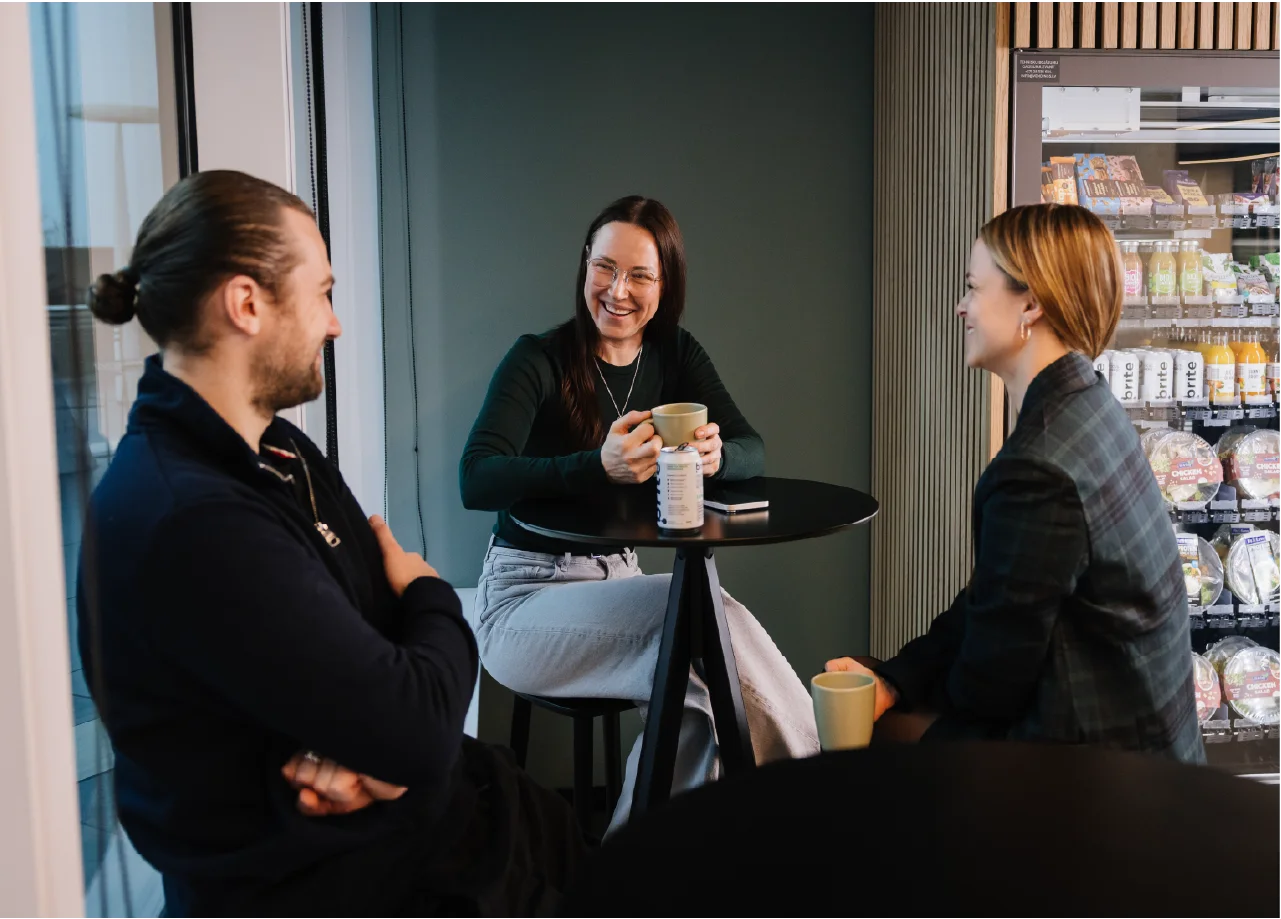People having lunch near a vending machine