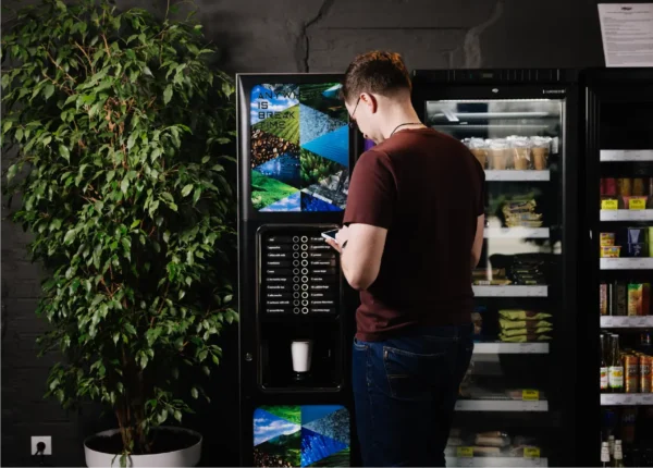 Person standing in front of a vending machine
